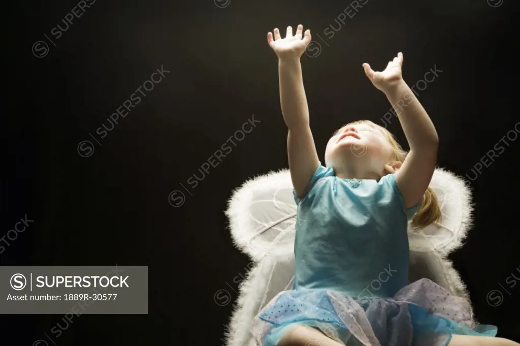 Girl (3-4) wearing angel's costume