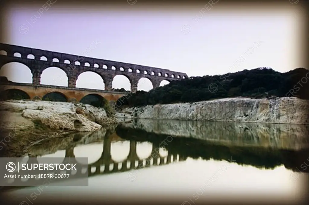 Old ruins of an aqueduct at Pont du Gard, Nimes, France  