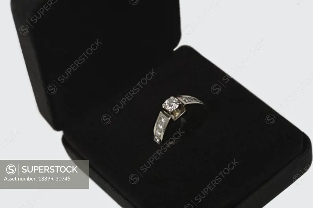 Close up of diamond ring in velvet box