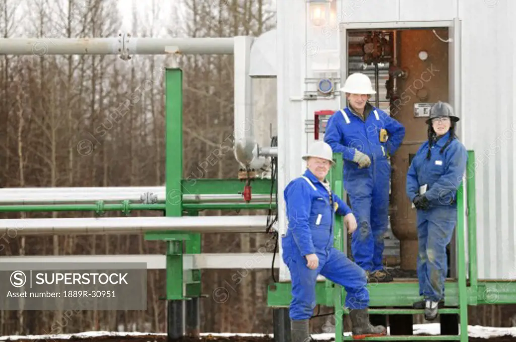 Industrial workers at an oilfield