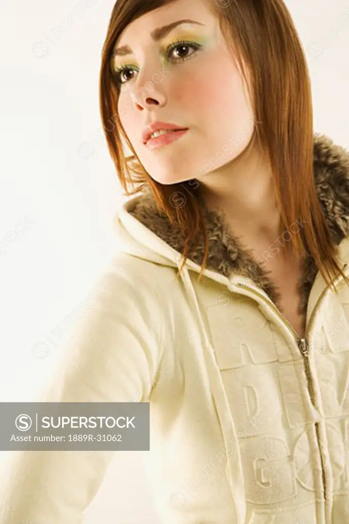 Young woman modelling zip-up, faux-fur, hooded sweater