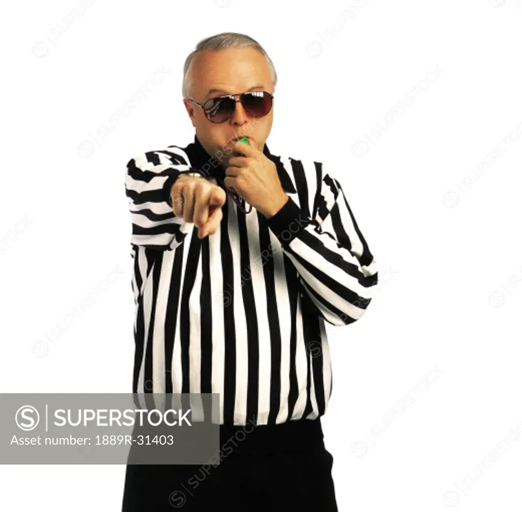 Referee wearing sunglasses and pointing finger