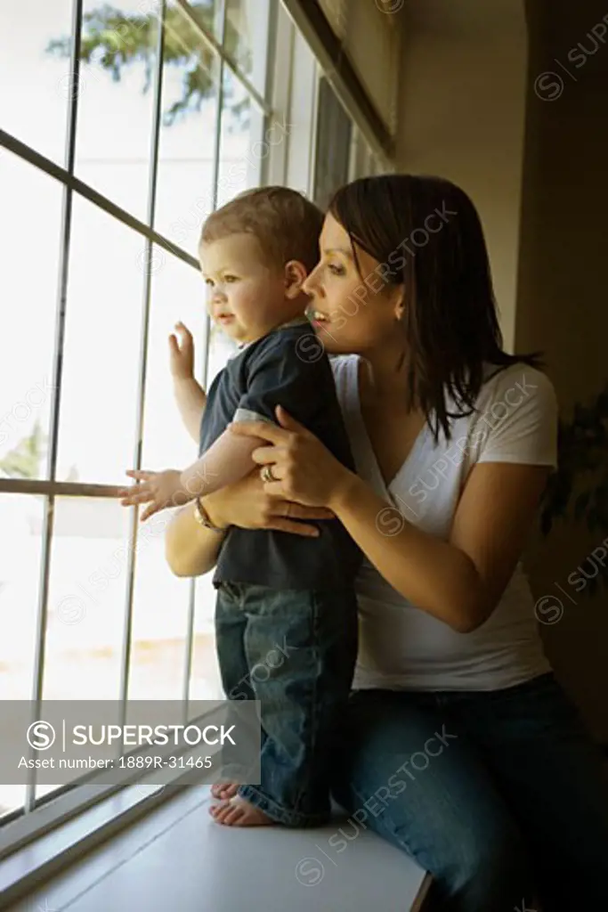 Side view of mother sitting with son