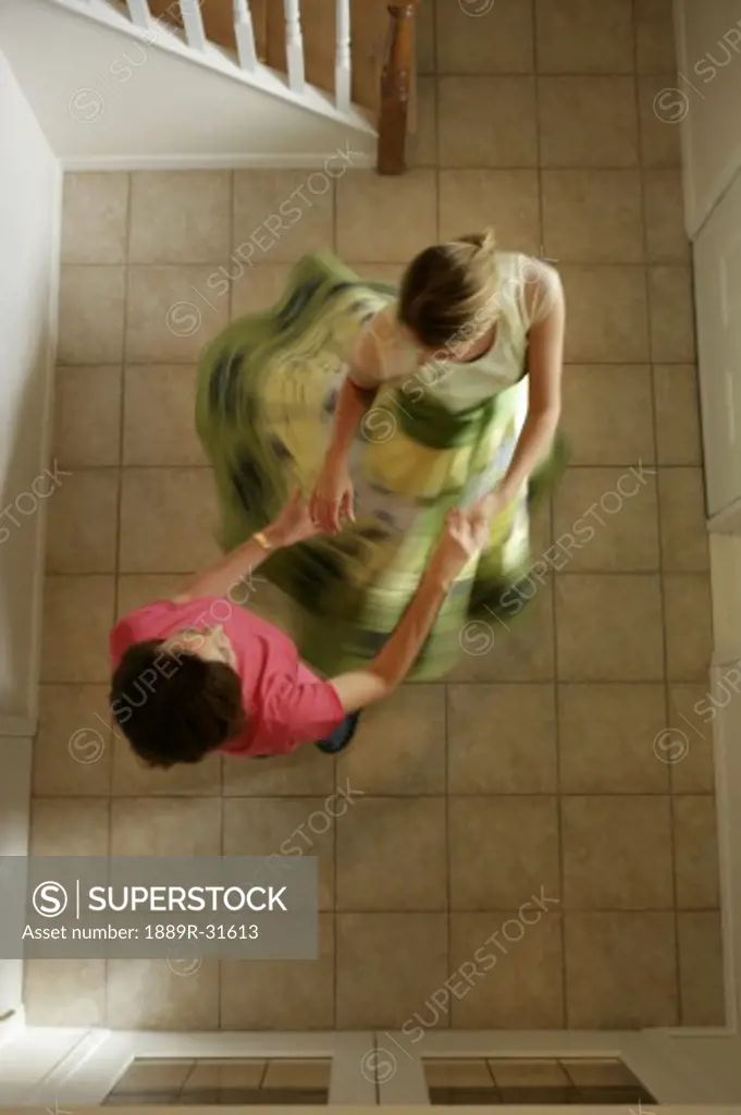 Mom and daughter dancing