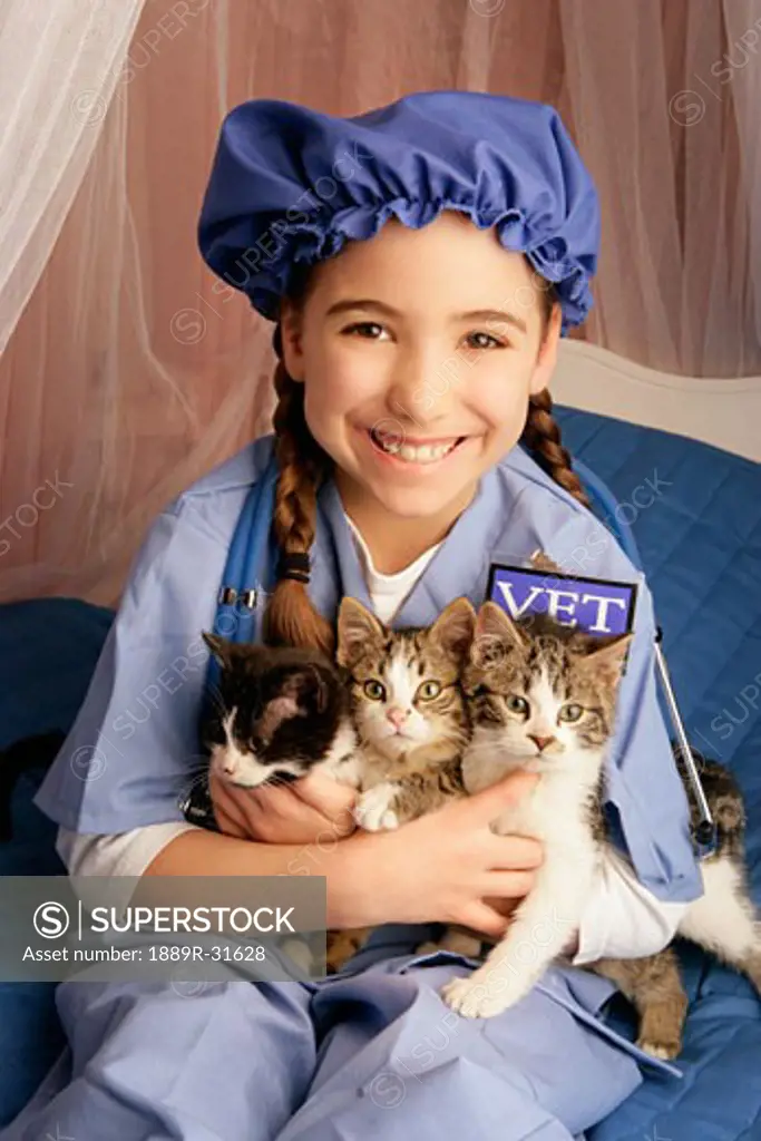 Front view of girl sitting with cats