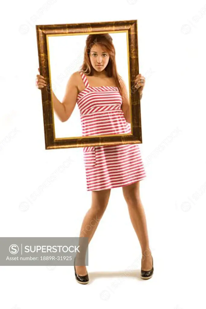 Woman posing with picture frame