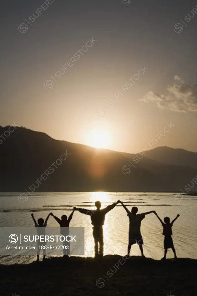 A group of people raising their hands