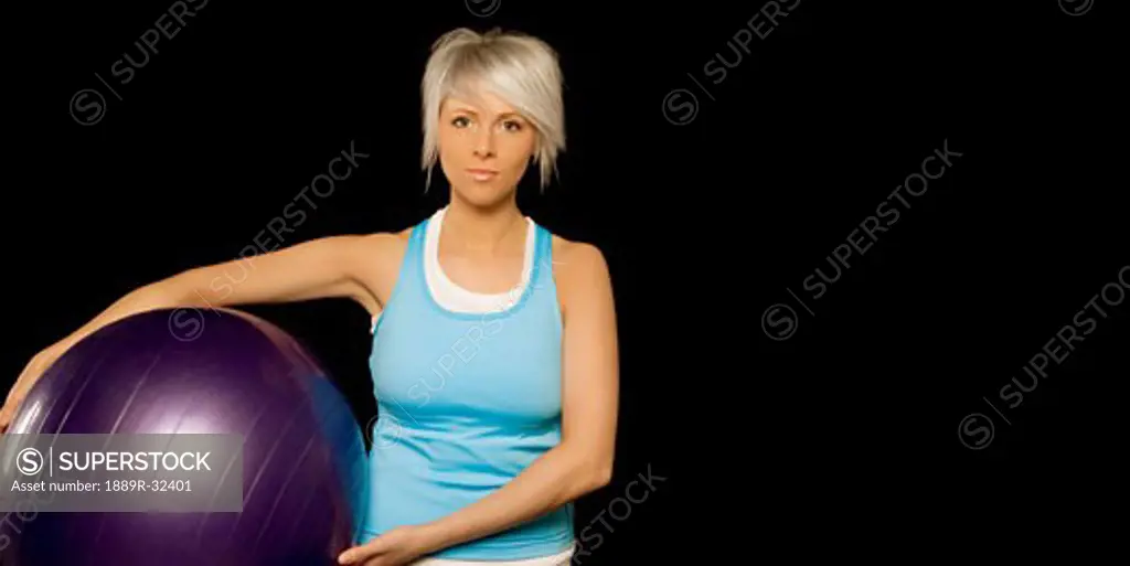 Woman holding exercise ball