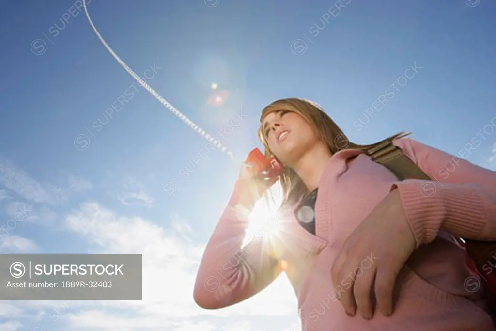 Low angle view of a woman talking on phone