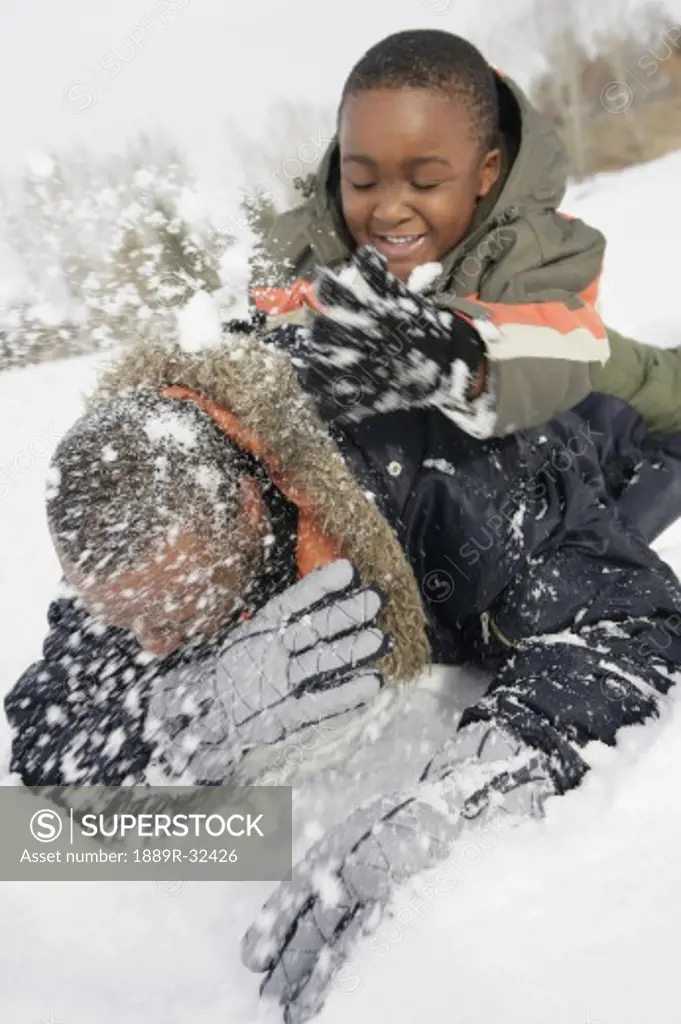 Father and son playing in snow