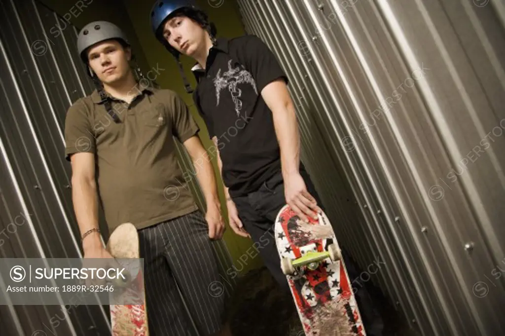 Teenage boys with skateboards