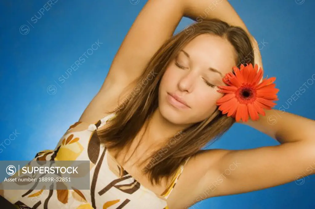 Brunette model with flower in her hair
