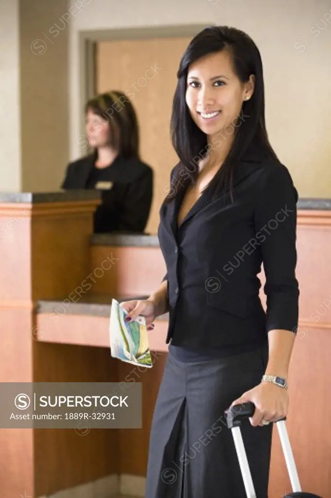Woman standing in hotel lobby