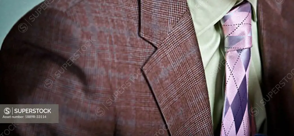 Closeup of a tie and mismatched suit