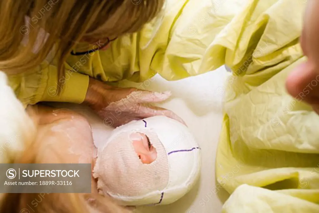 An infant with a head cast