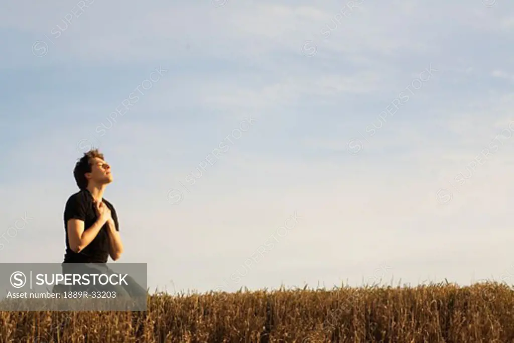 A man kneeling in worship to God