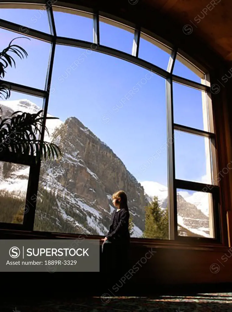 A mountain view through a window