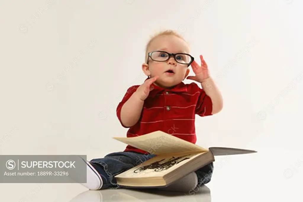 Infant with a book