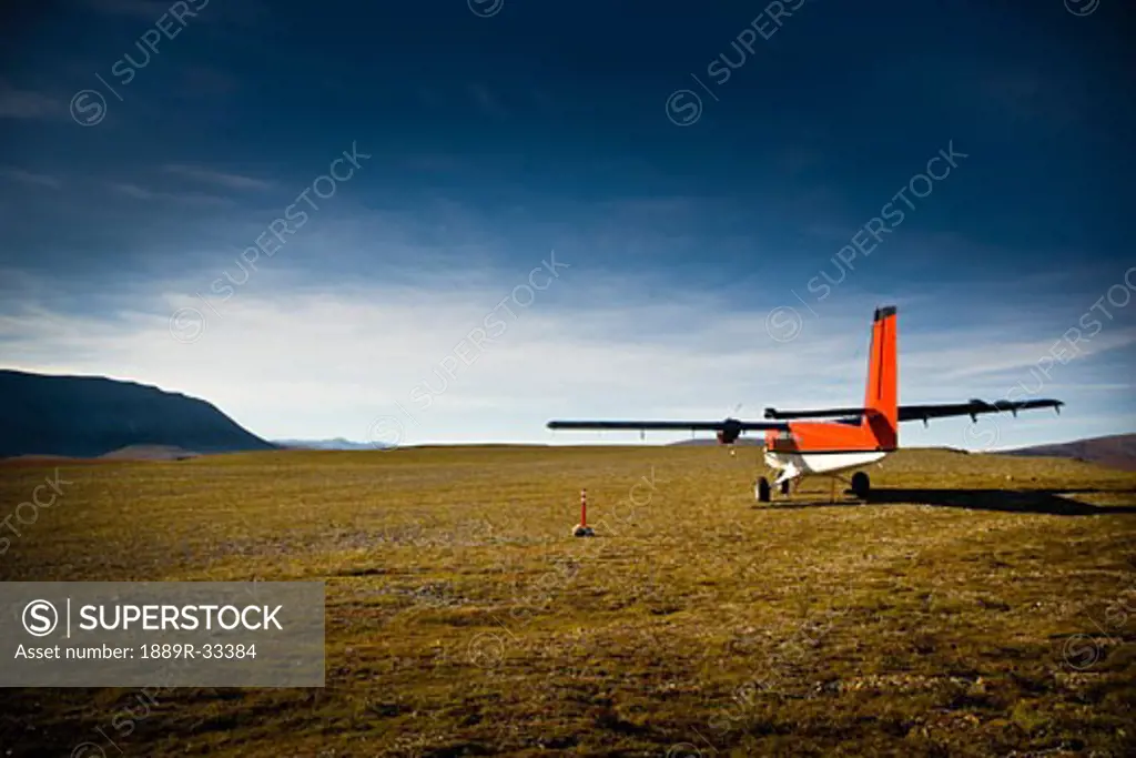 Small aircraft in field