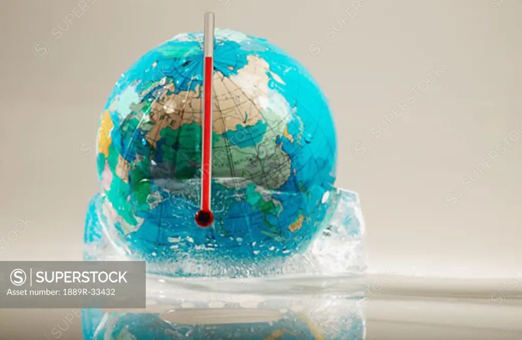 Globe in ice and thermometer
