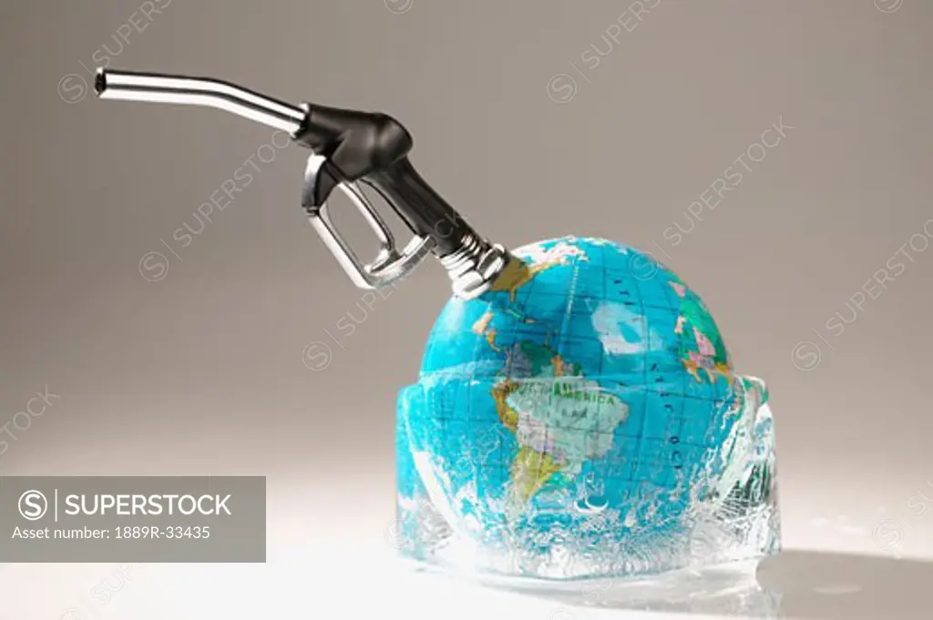 Gas nozzle sticking out of globe in ice