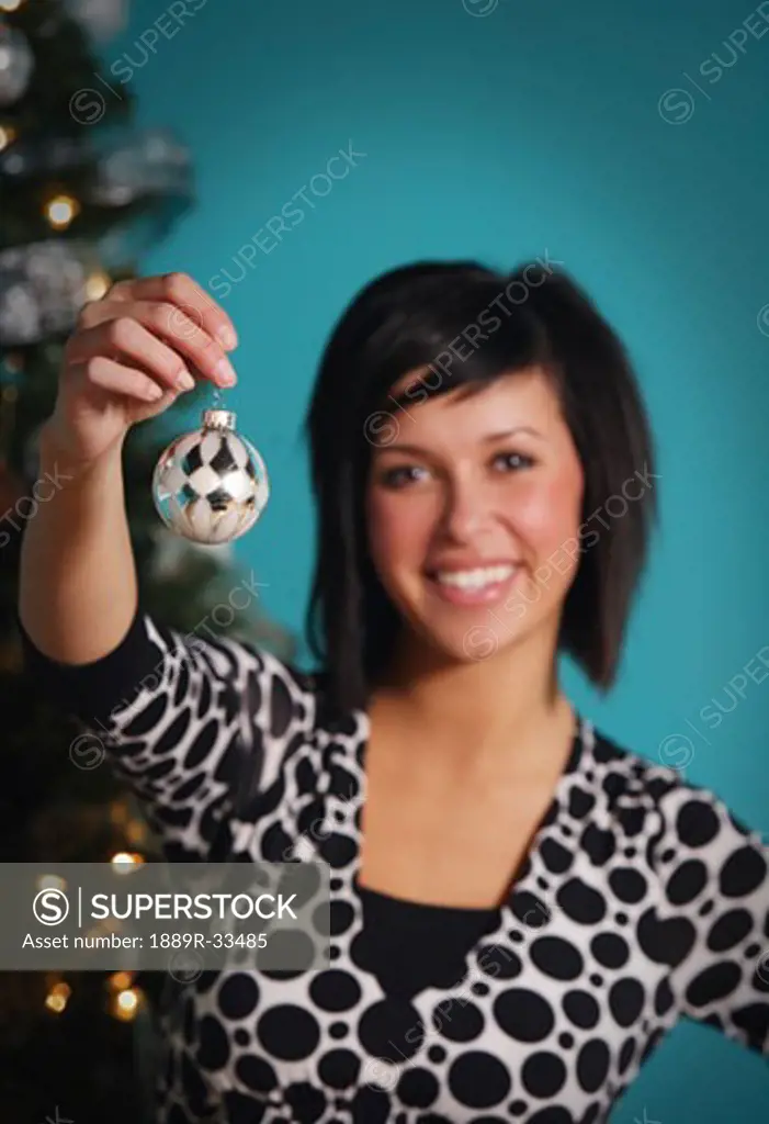 Woman holding Christmas ornament