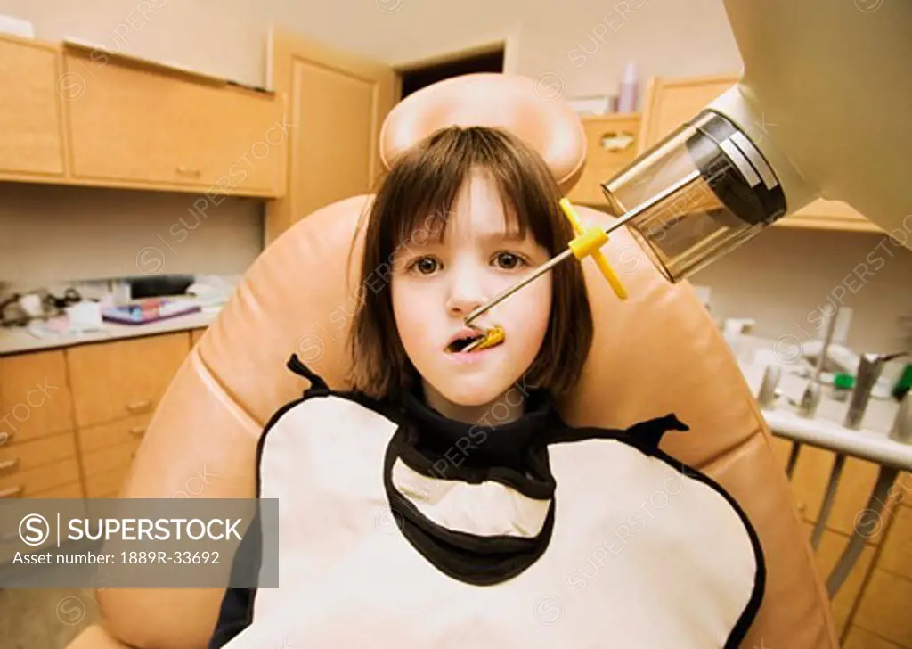 Girl getting dental x-ray