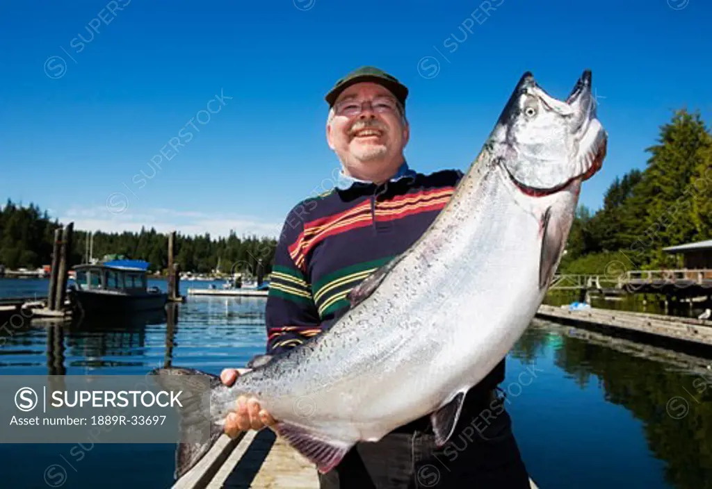 A man holding a large fish