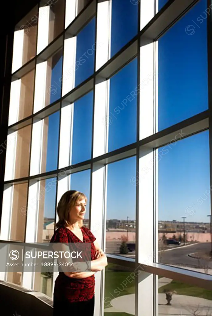 Woman watching out a window