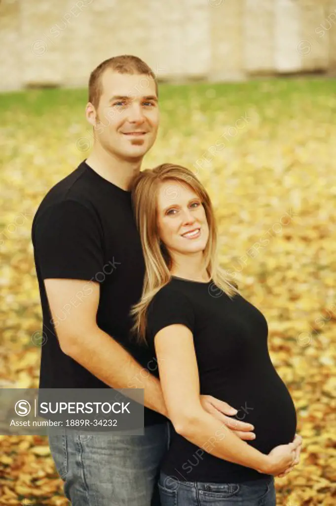 Couple with pregnant woman
