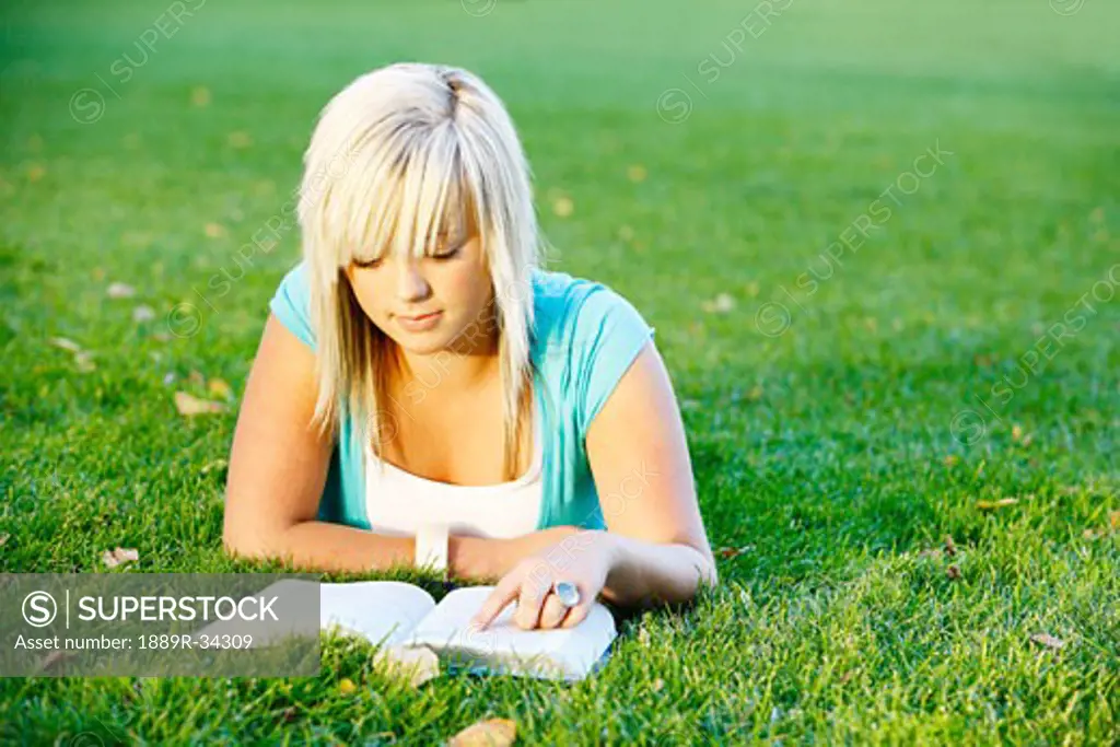 Teenage girl reading her Bible