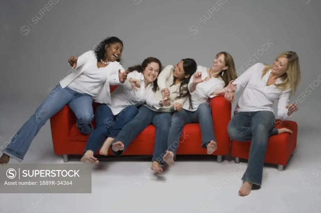 A group of woman on a couch