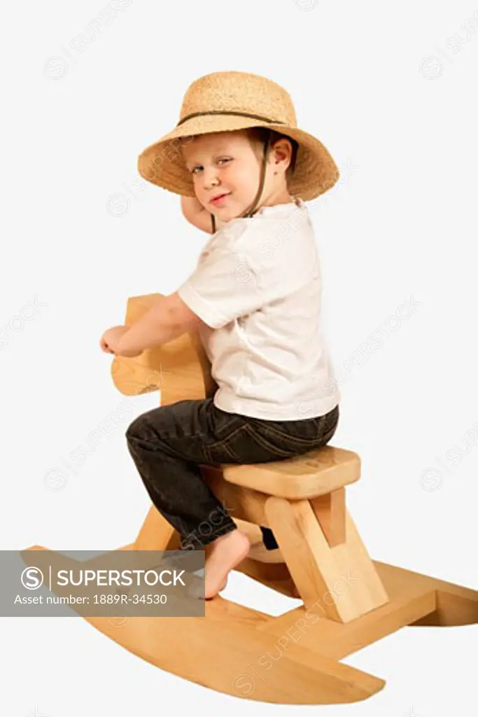 Little boy on a rocking horse  