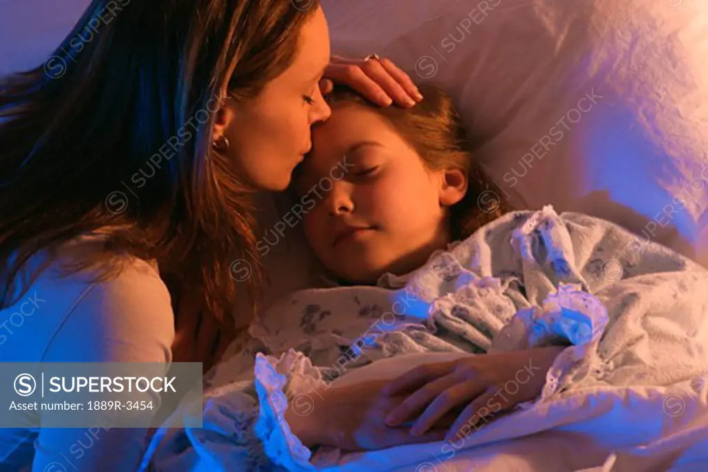 Mother with sleeping daughter