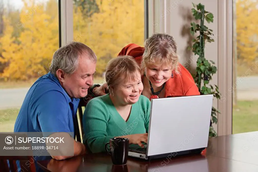 Family on laptop computer