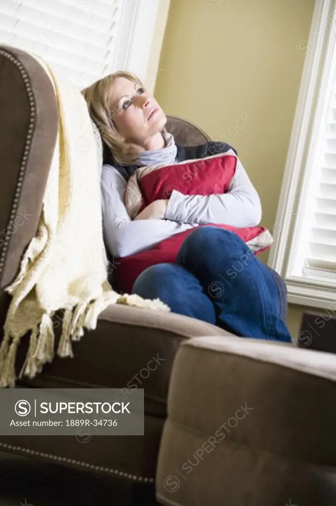 Woman sitting on couch
