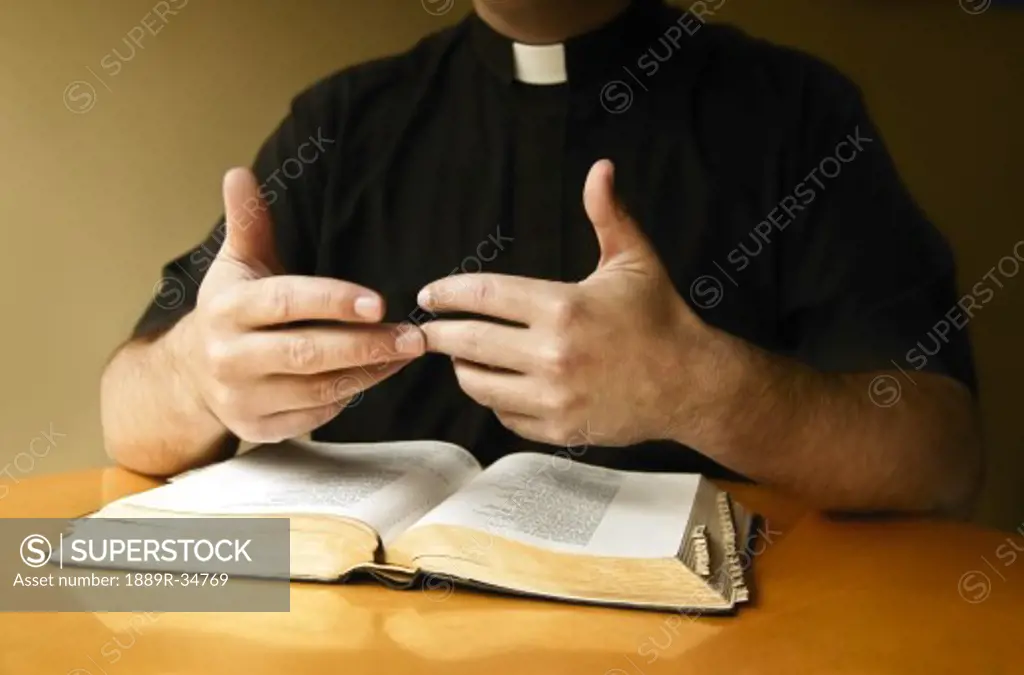 Priest with Bible