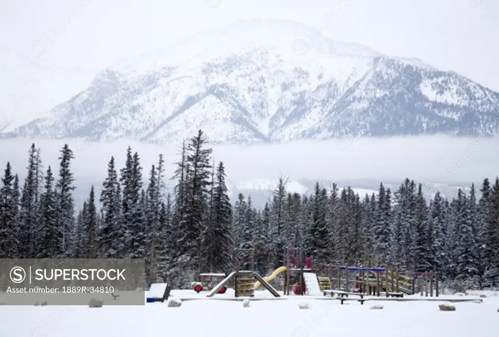 Playground and mountains in the winter