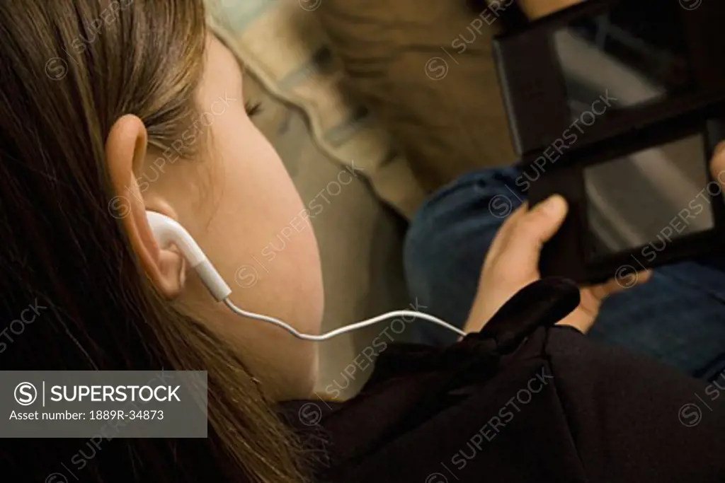 Girl with earbuds