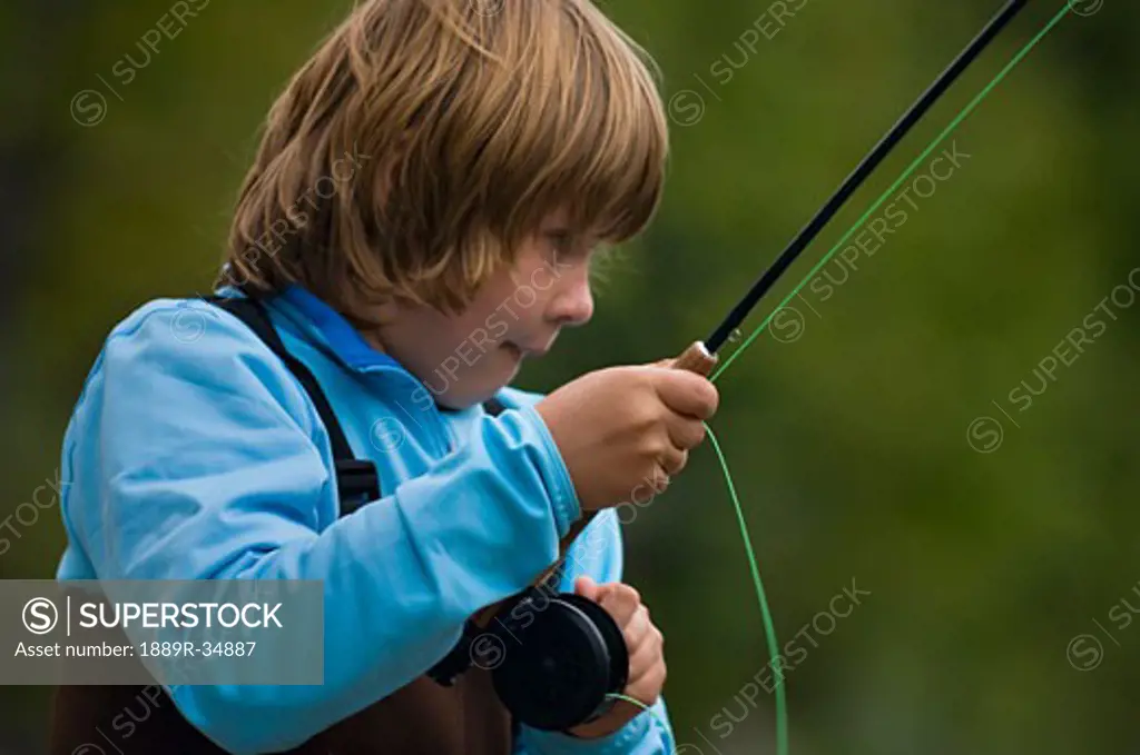 Boy fly fishing  