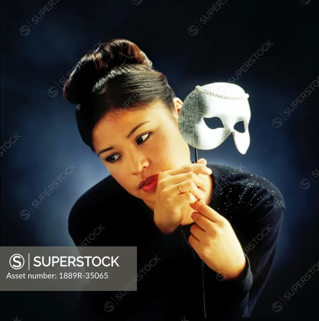 Woman holding mask