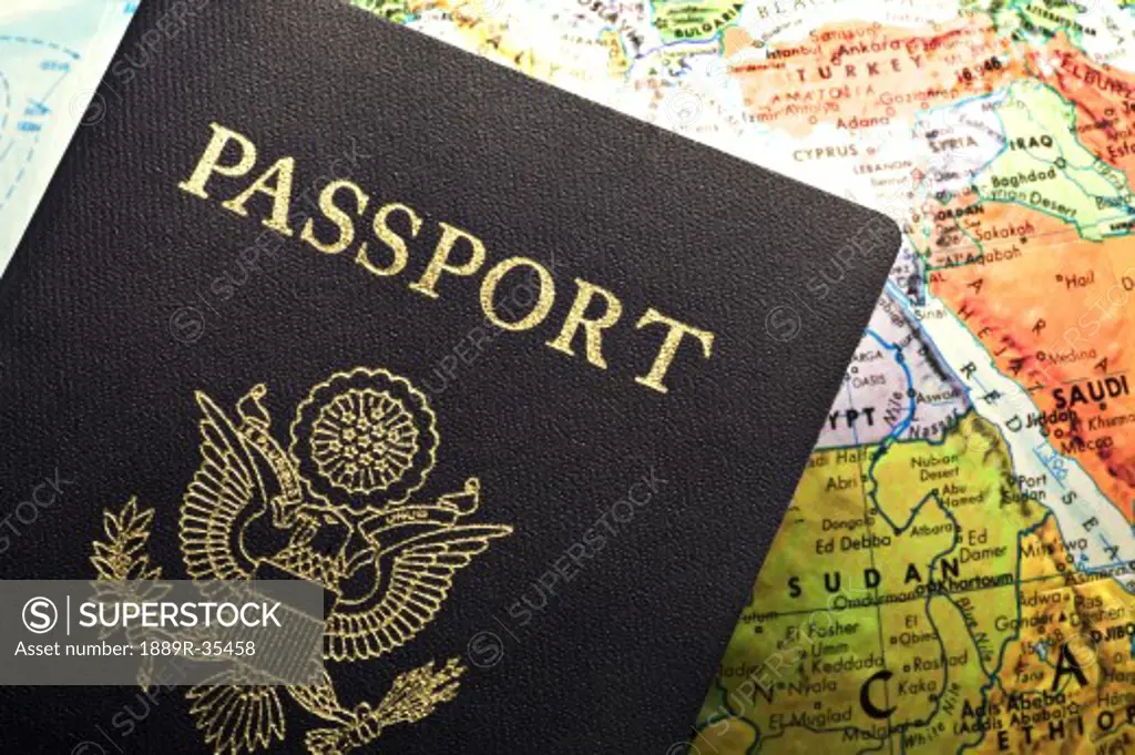 American Passport laid over a map