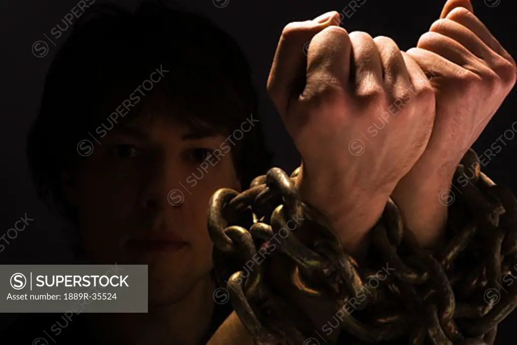 Man with chains on his wrists