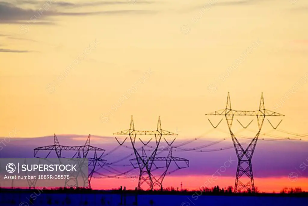 Silhouetted transmission towers