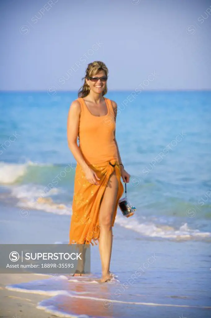 Woman walking on the beach, Playa del Carmen, Mayan Riviera, Mexico