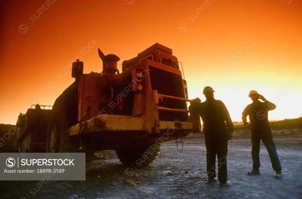 Construction workers and tractor