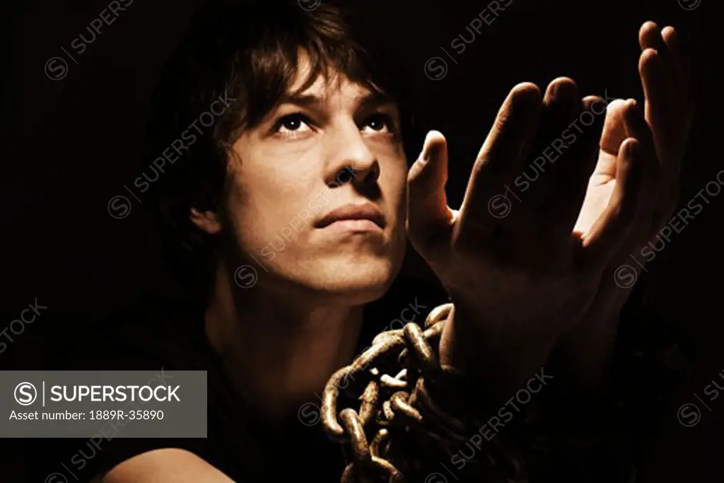 Man with chained hands