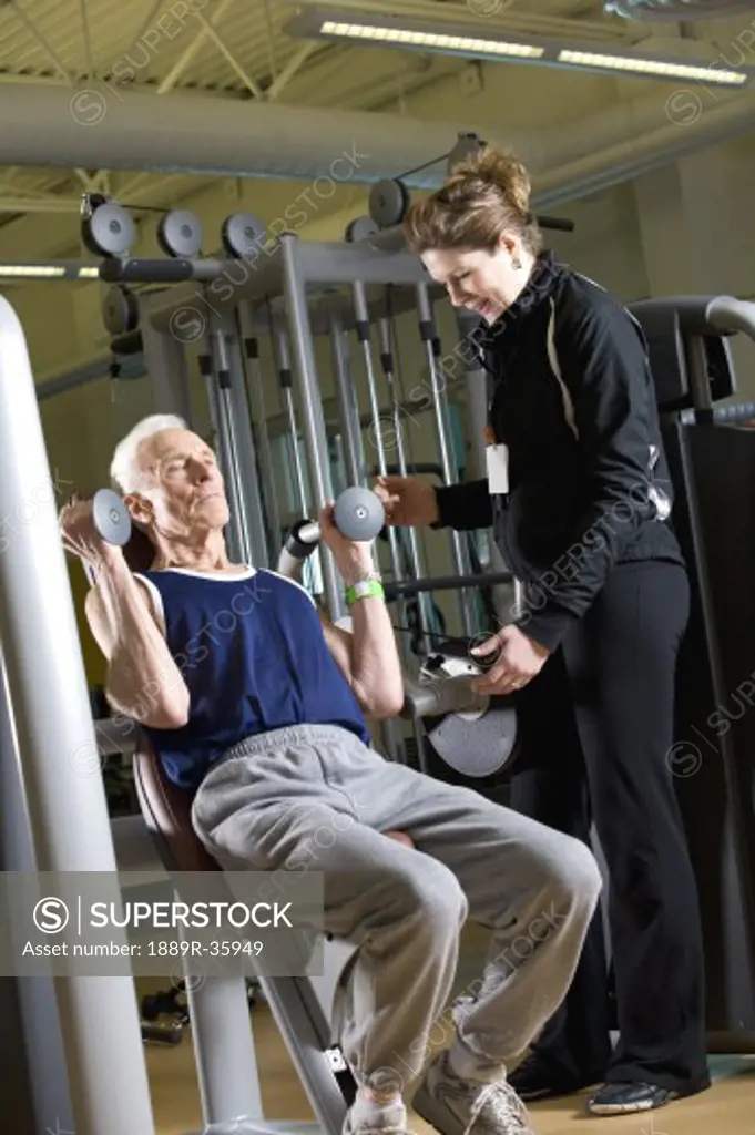 Man working out with trainer