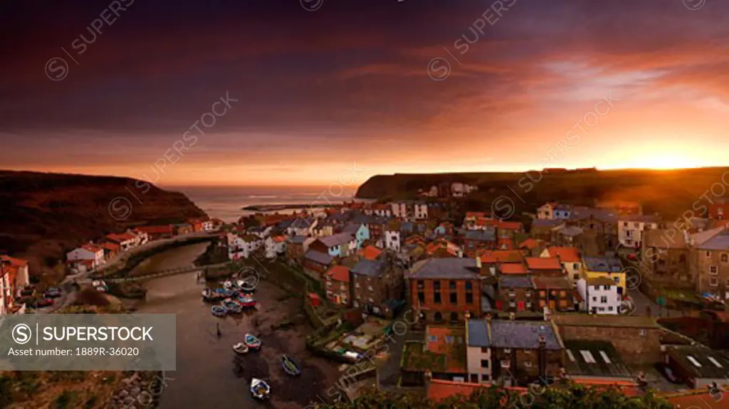 Wide angle cityscape at sunset, Staithes, Yorkshire, England