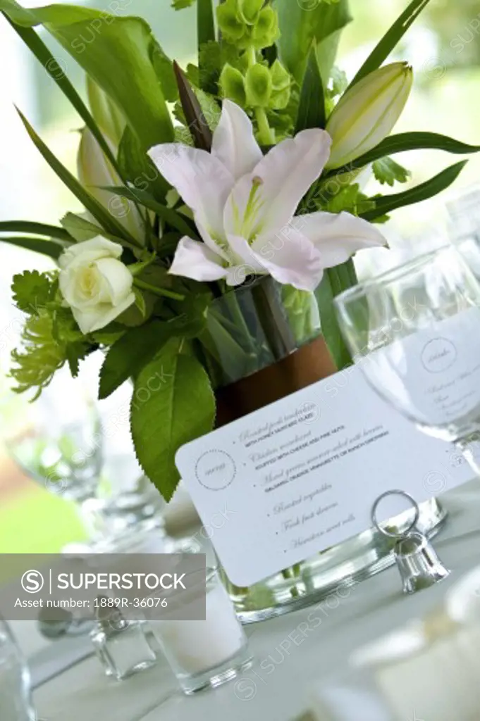 Menu card on table next to flower vase